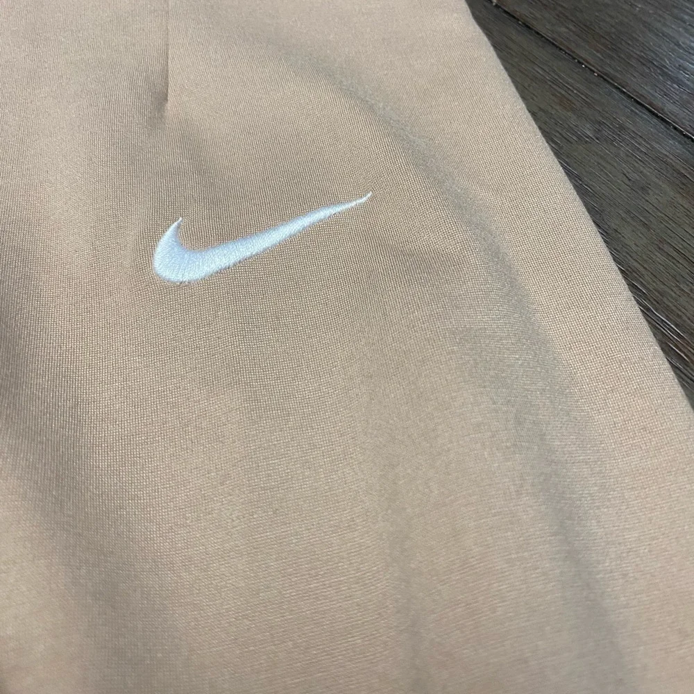 Nike embroidered-swoosh detail leggings pleated front size small